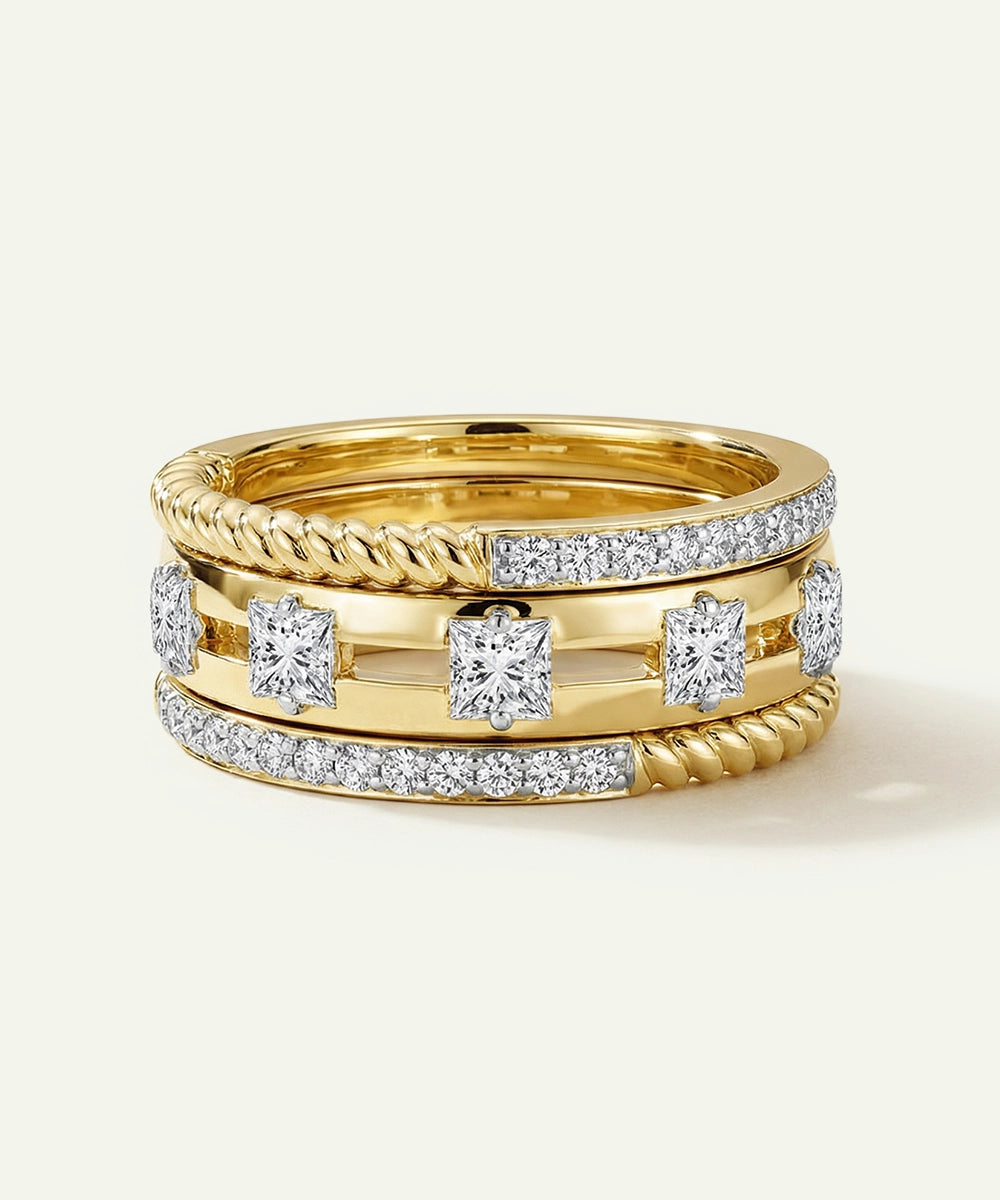 Three gold rings with diamond accents on a white background