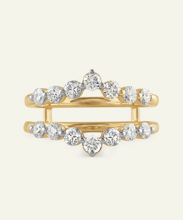 Gold ring with diamond stones on a white background