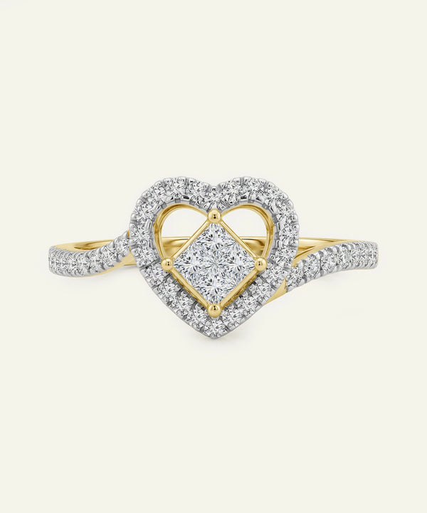 Heart-shaped diamond ring with gold and silver accents on a white background