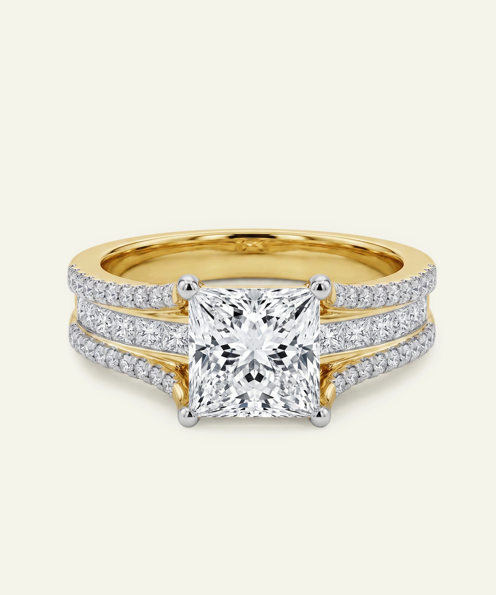 Gold ring with a large diamond and smaller diamonds on the band against a white background
