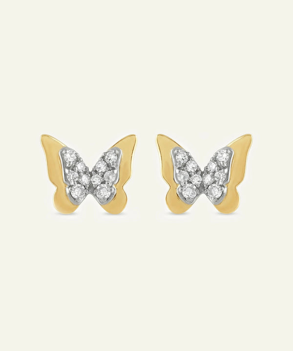 Butterfly-shaped earrings with gold and silver design on a white background