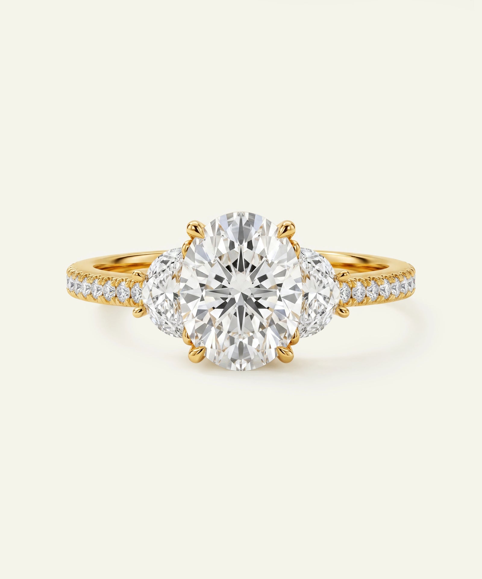 Gold diamond ring on a light beige background