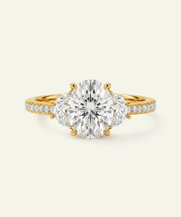 Gold diamond ring on a light beige background