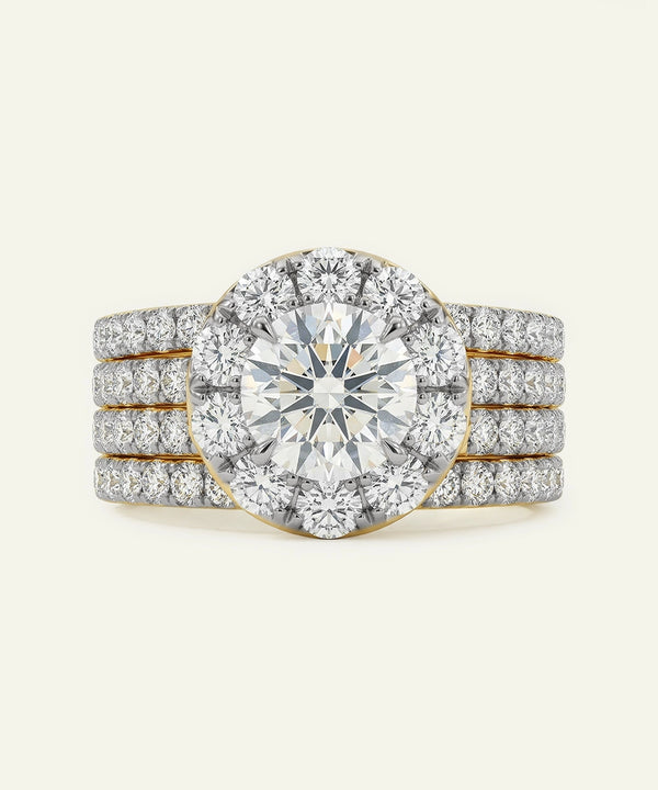 Diamond ring with a halo and multiple bands on a white background