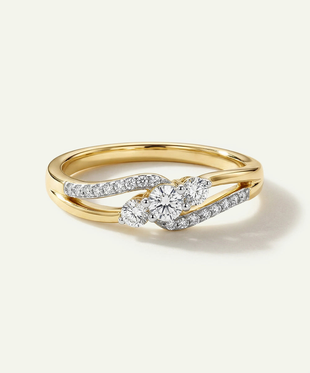 Gold ring with diamond accents on a light gray background