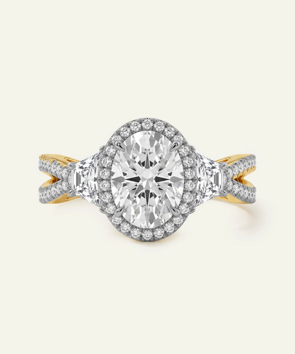 Diamond ring with gold and silver band on a white background