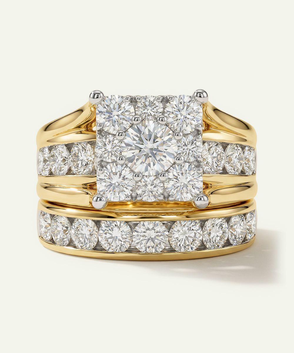 Gold ring with a large diamond and smaller diamonds on the band against a white background