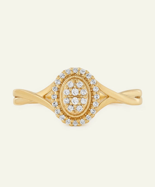 Gold ring with diamond accents on a white background