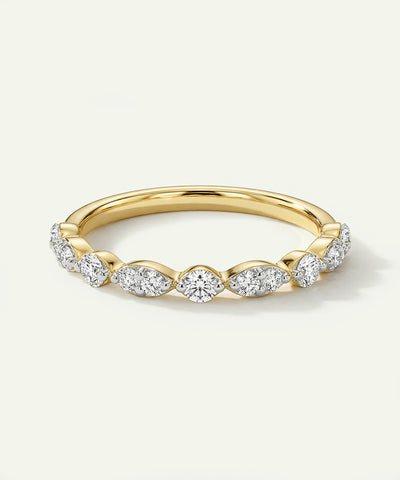 Scalloped diamond anniversary ring with a polished yellow gold band.