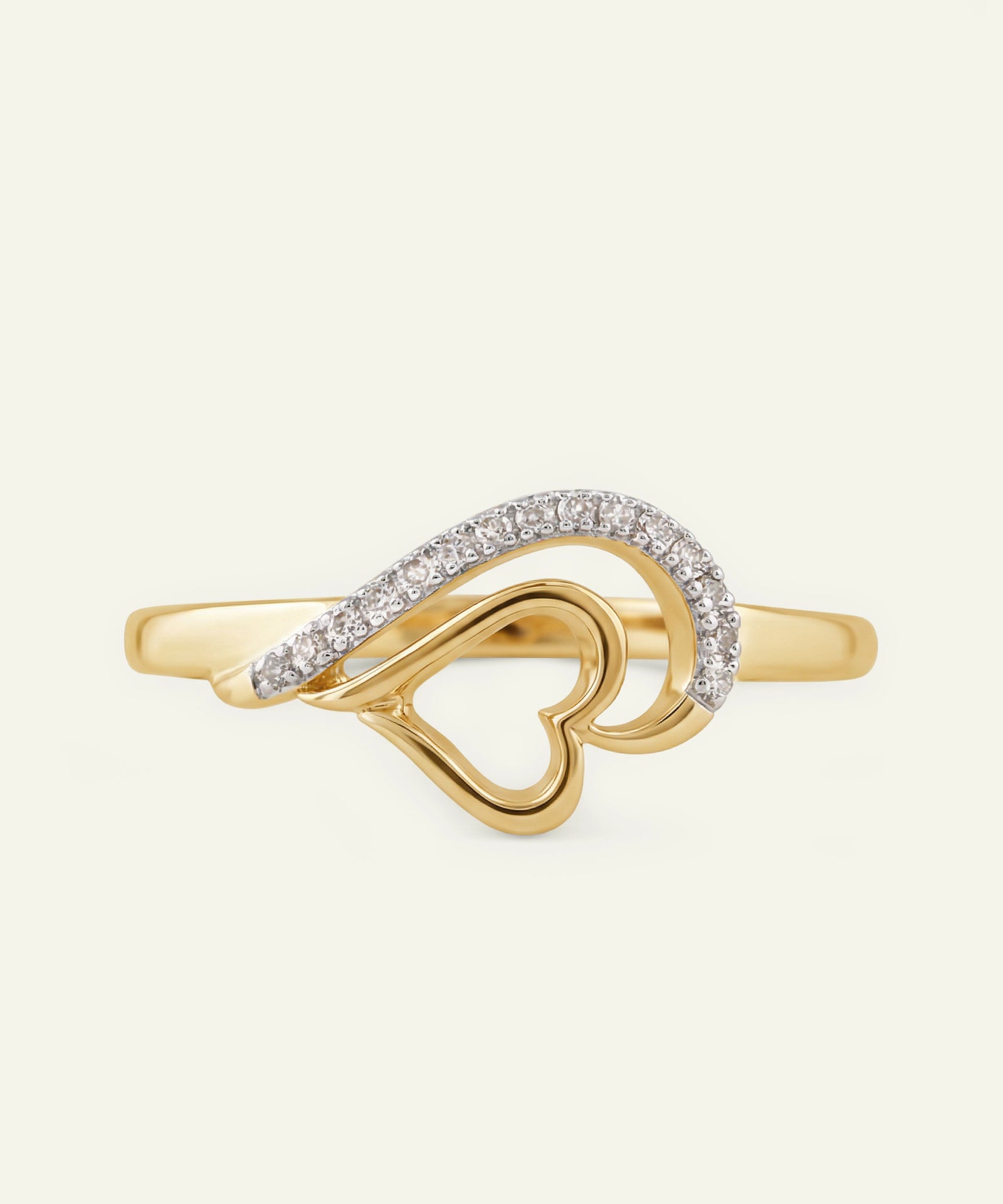 Gold ring with heart design and diamond accents on a white background