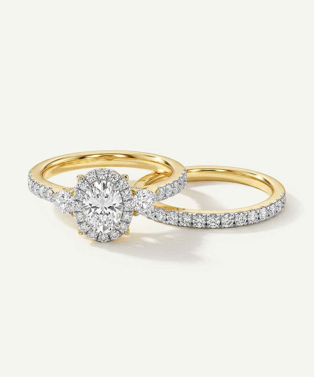 Gold ring with diamond band on a white background