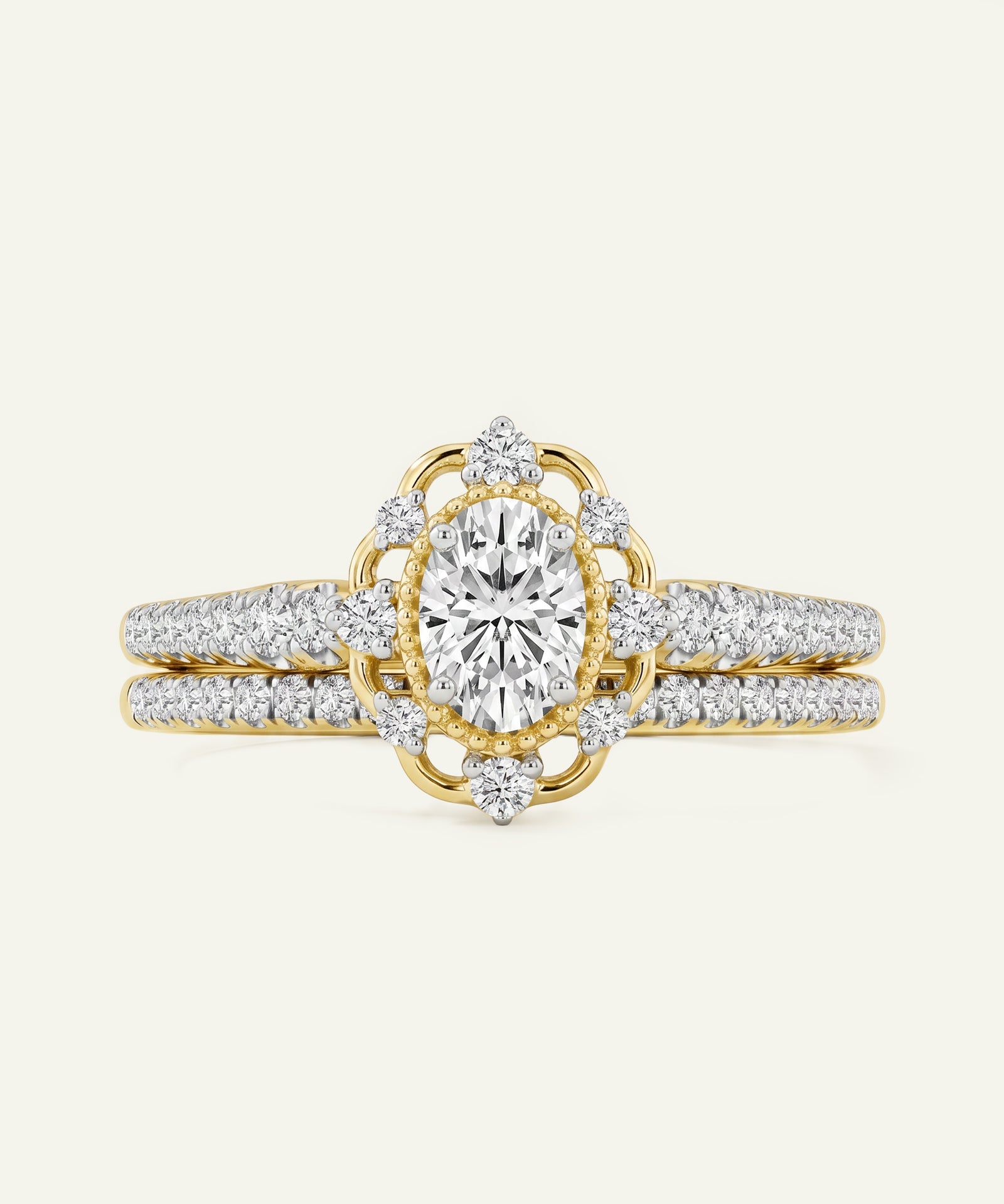 Gold and diamond ring on a light beige background
