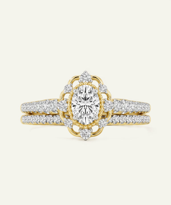 Gold and diamond ring on a light beige background