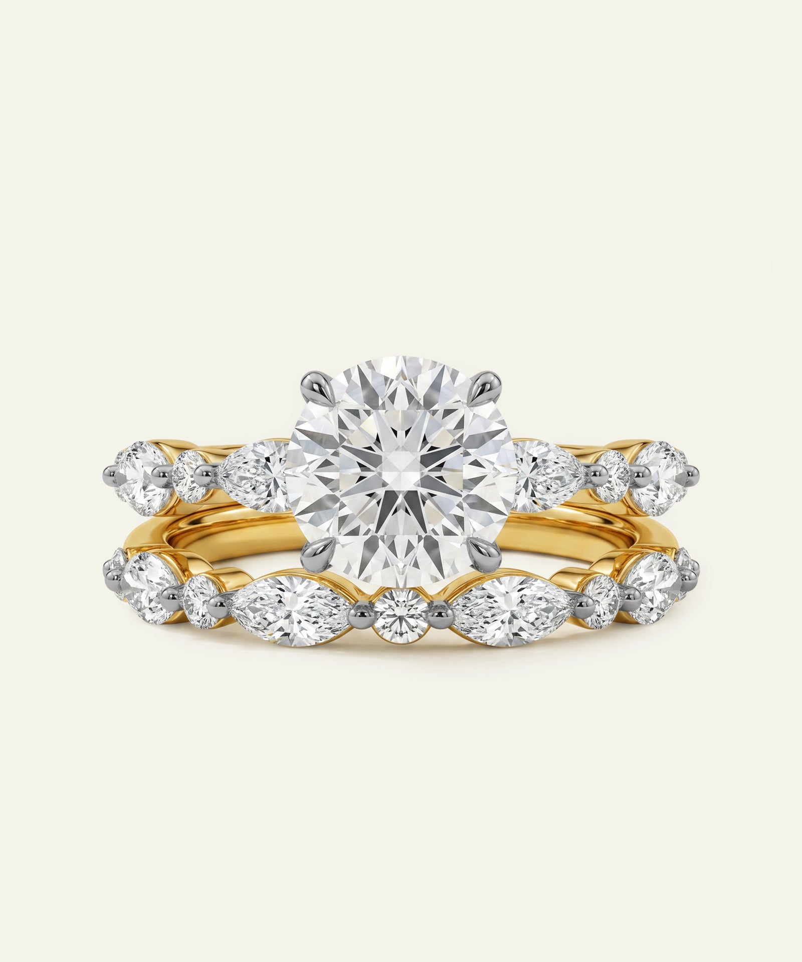 Gold ring with a large diamond and smaller diamonds on a light gray background
