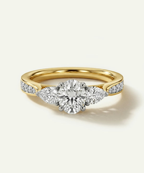 Gold ring with a diamond on a light gray background