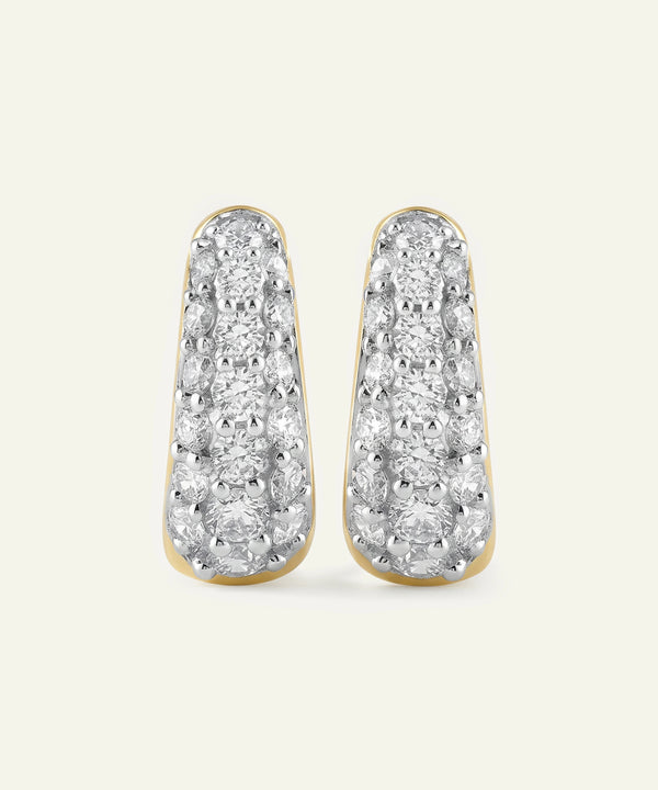 Pair of diamond earrings on a light gray background
