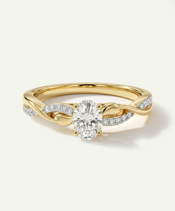 Gold ring with a diamond on a light beige background