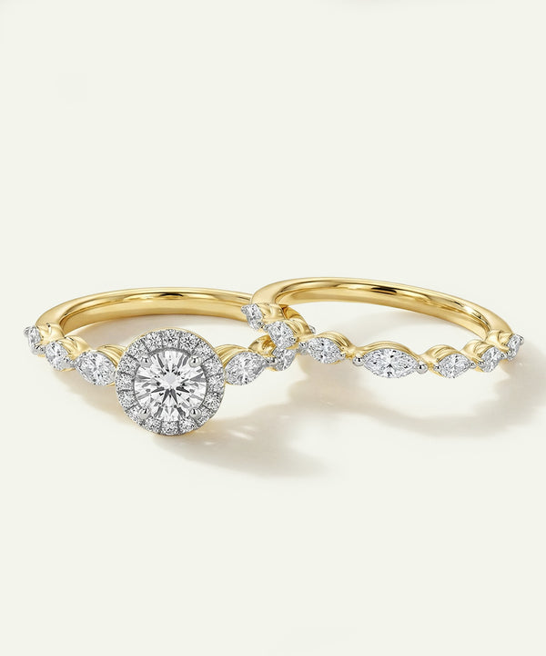 Two gold rings with diamond accents on a white background