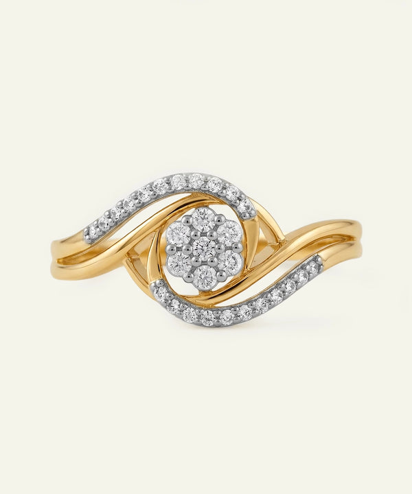 Gold and silver ring with diamond accents on a light beige background