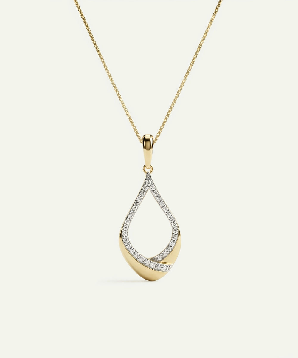 Gold and silver teardrop-shaped pendant on a chain against a white background