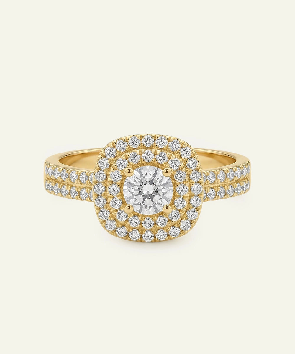 Gold ring with a large central diamond and smaller diamonds around on a beige background