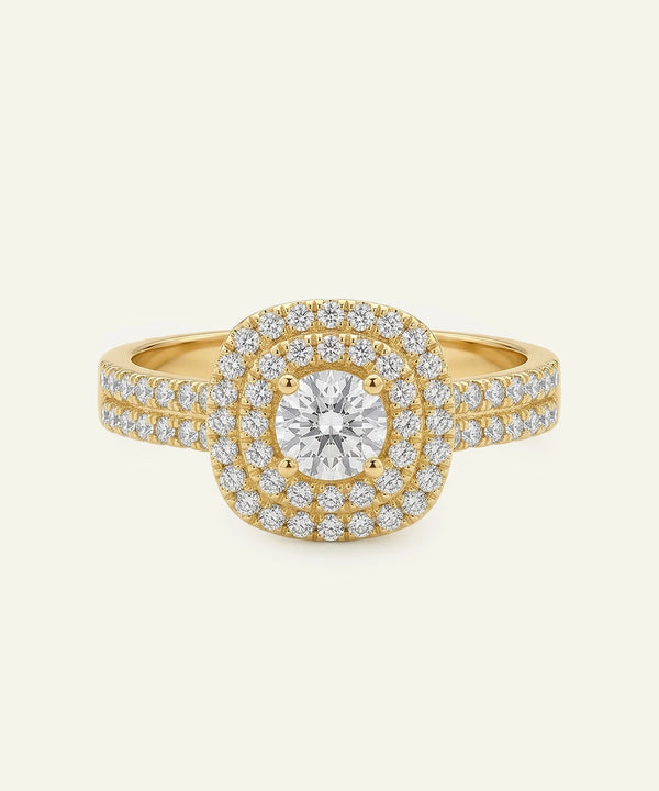 Gold ring with a large central diamond and smaller diamonds around on a beige background