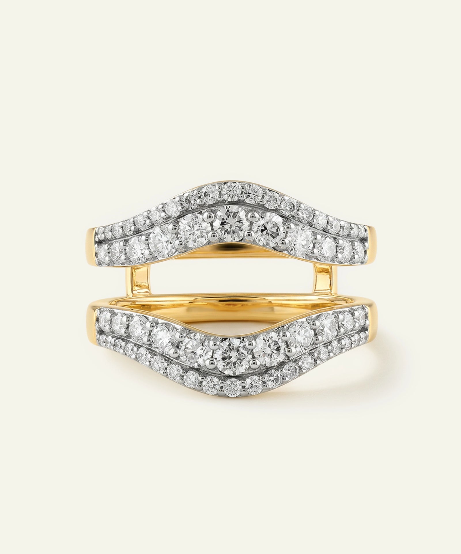 Gold and silver ring with diamond accents on a white background