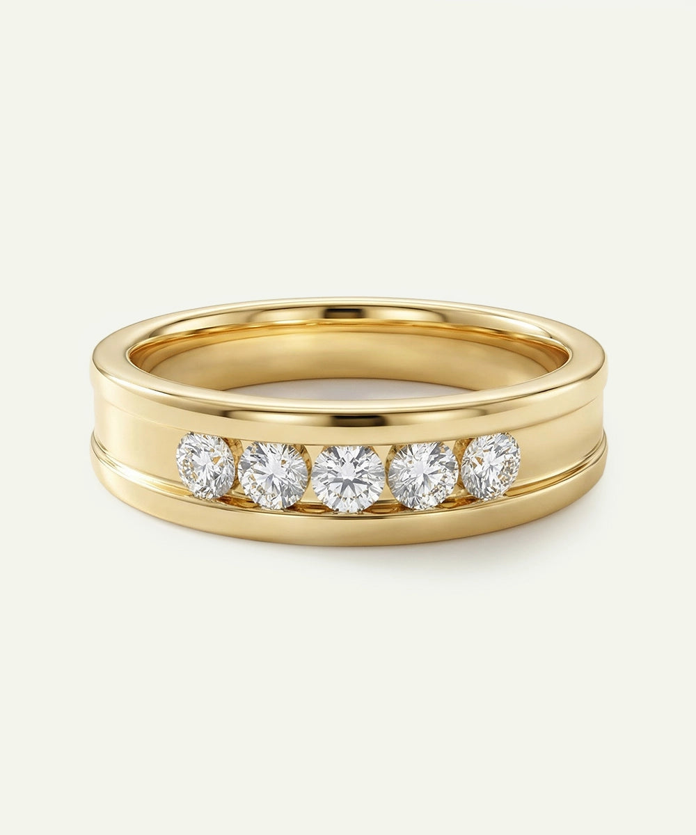 Gold ring with diamonds on a light gray background