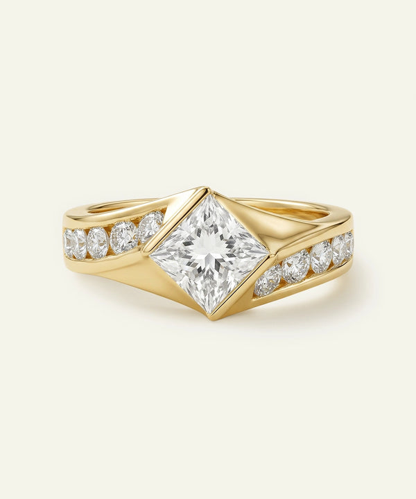 Gold ring with a large diamond and smaller diamonds on a beige background