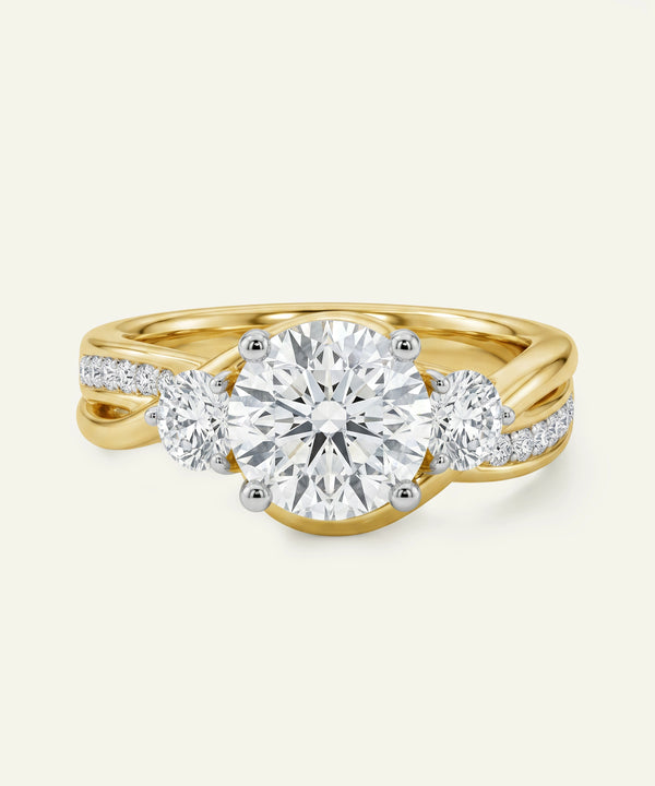 Gold ring with three diamonds on a white background