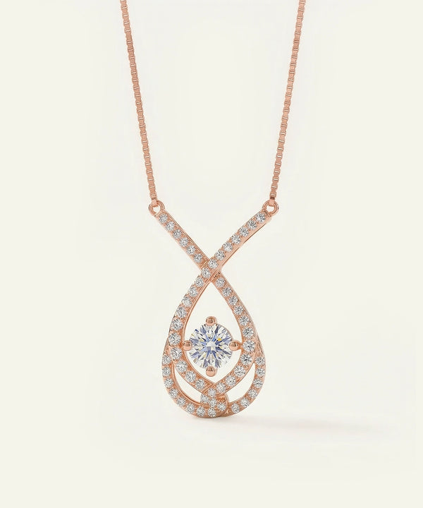 Rose gold necklace with a diamond pendant on a light beige background
