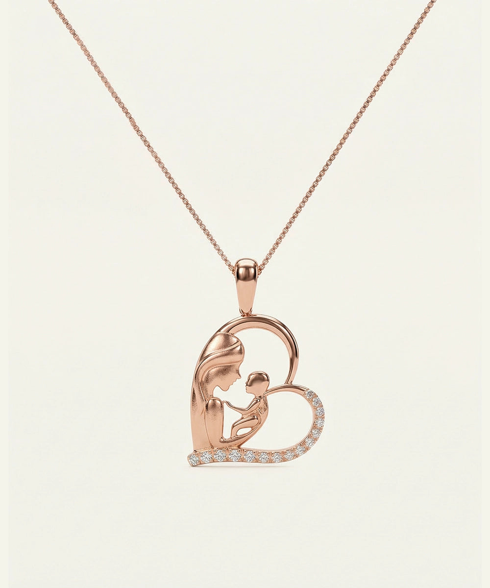 Rose gold heart-shaped pendant with a chain on a light beige background