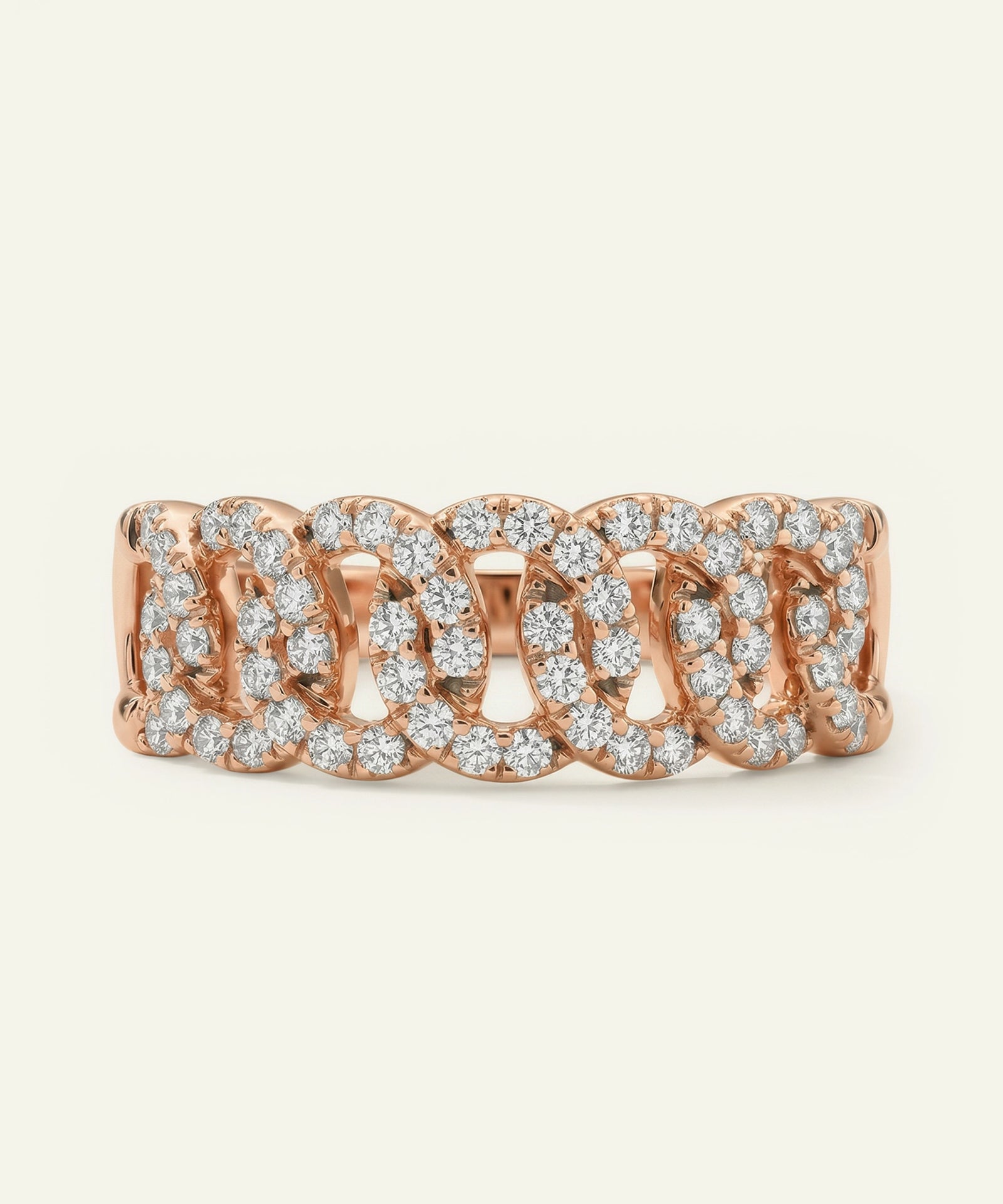 Rose gold ring with diamond accents on a white background