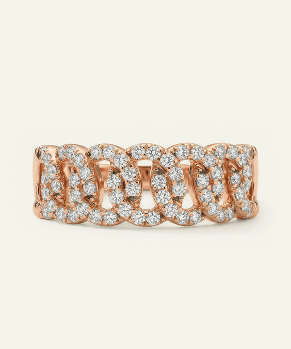 Rose gold ring with diamond accents on a white background