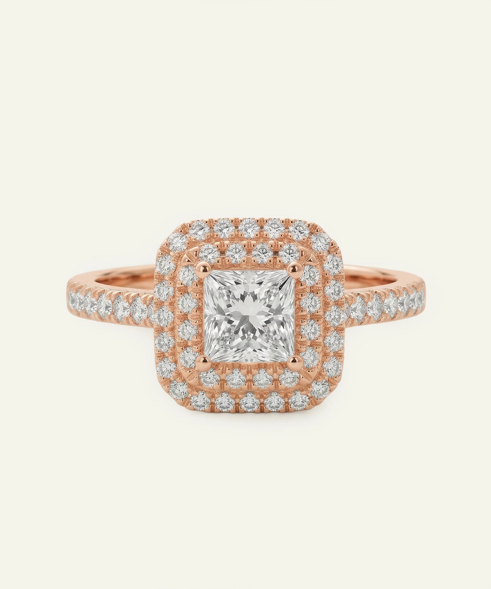 Rose gold ring with a diamond on a white background