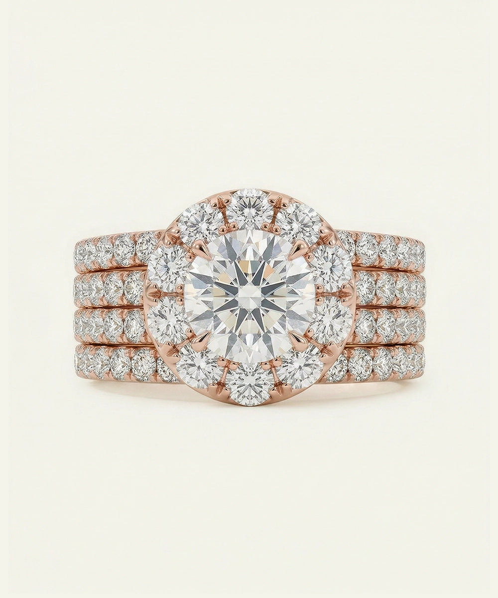 Rose gold diamond ring with a large central gemstone on a light beige background