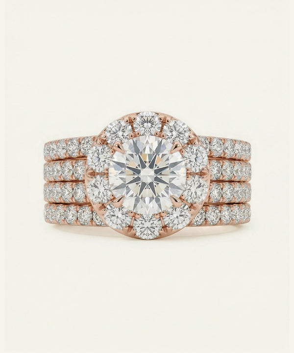 Rose gold diamond ring with a large central gemstone on a light beige background