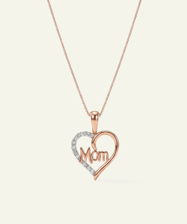 Rose gold heart-shaped necklace with 'Mom' pendant on a light beige background