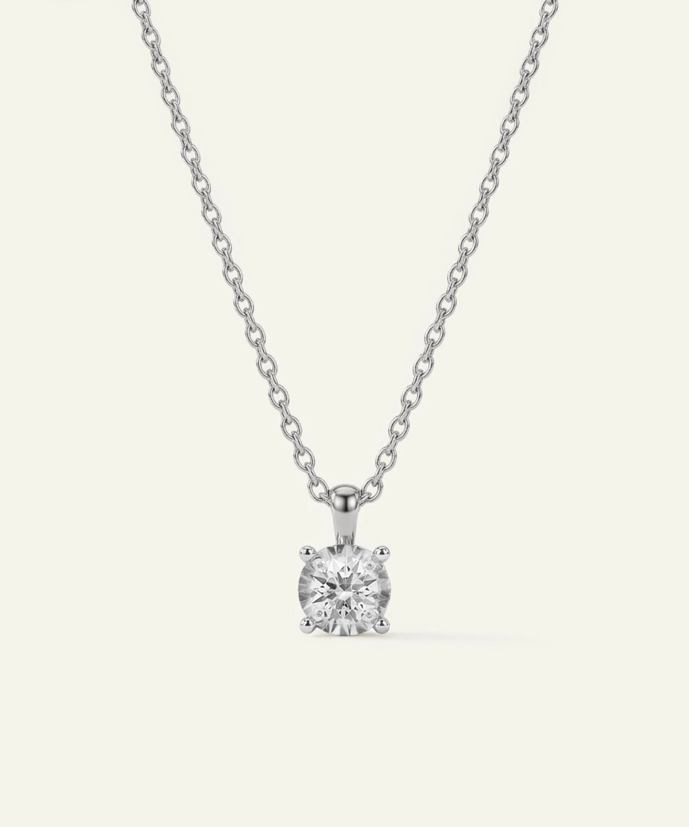 Diamond pendant necklace on a white background