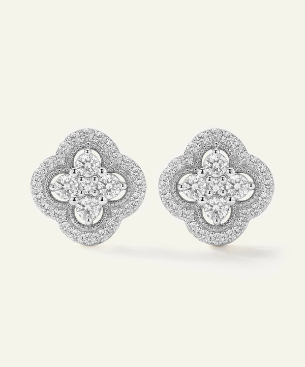 Pair of diamond earrings on a light gray background