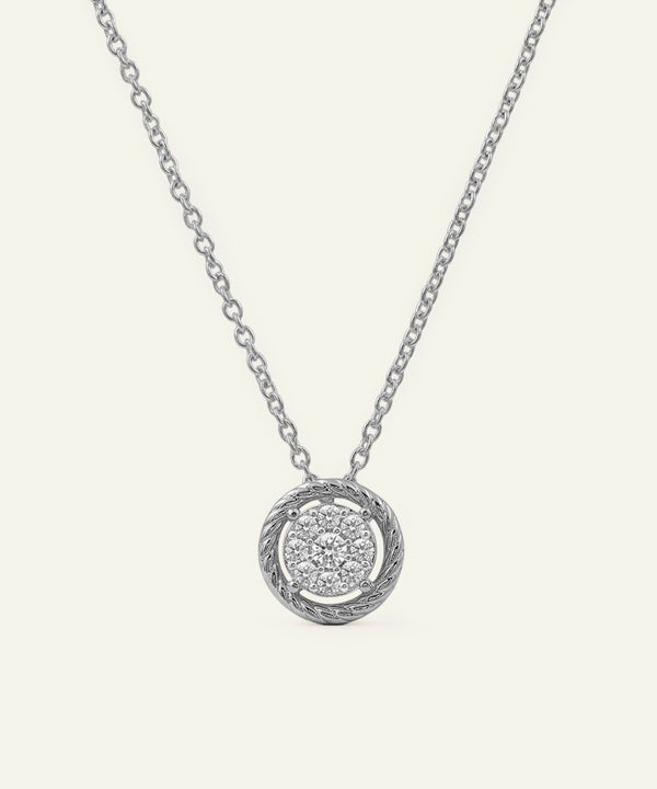 Silver necklace with a round pendant on a white background