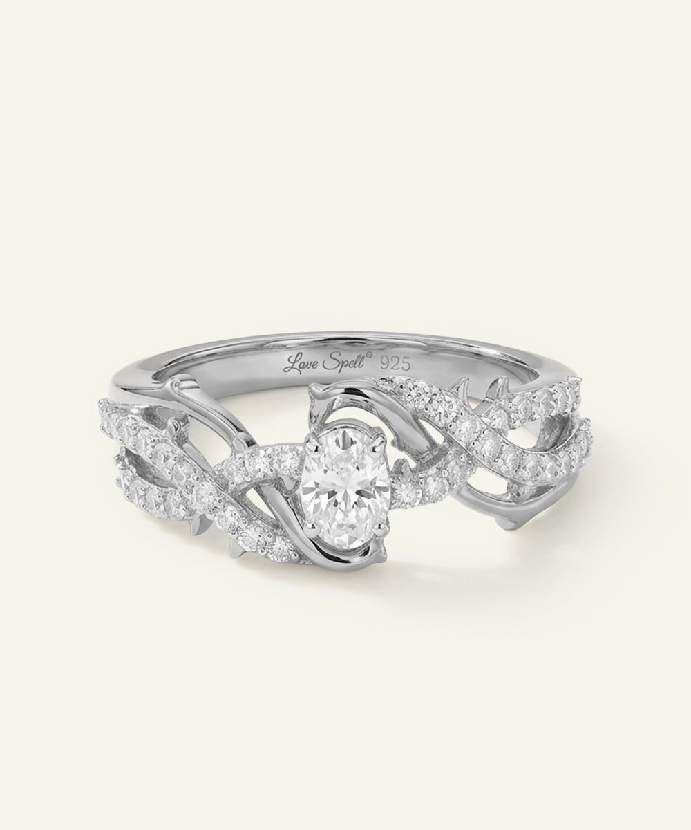 Silver ring with diamond accents on a white background