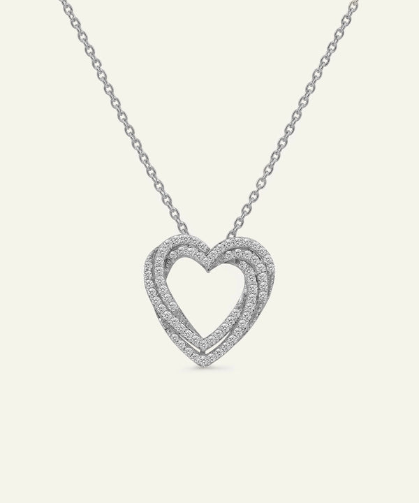 Heart-shaped diamond necklace on a white background