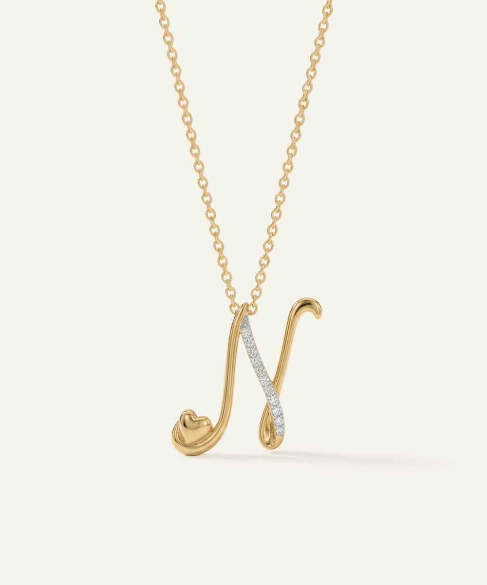 Gold necklace with a unique pendant on a light beige background
