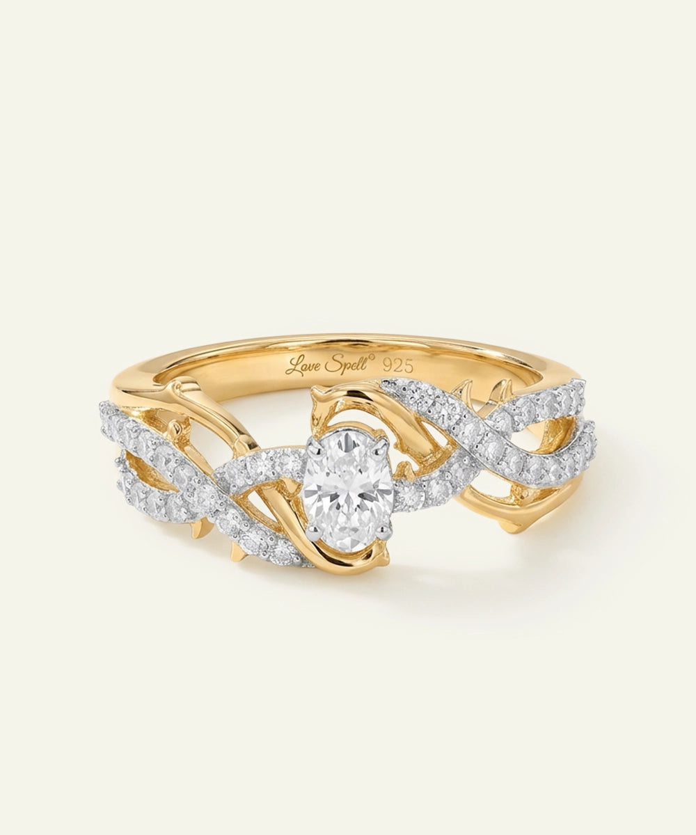 Gold ring with diamond accents on a light beige background