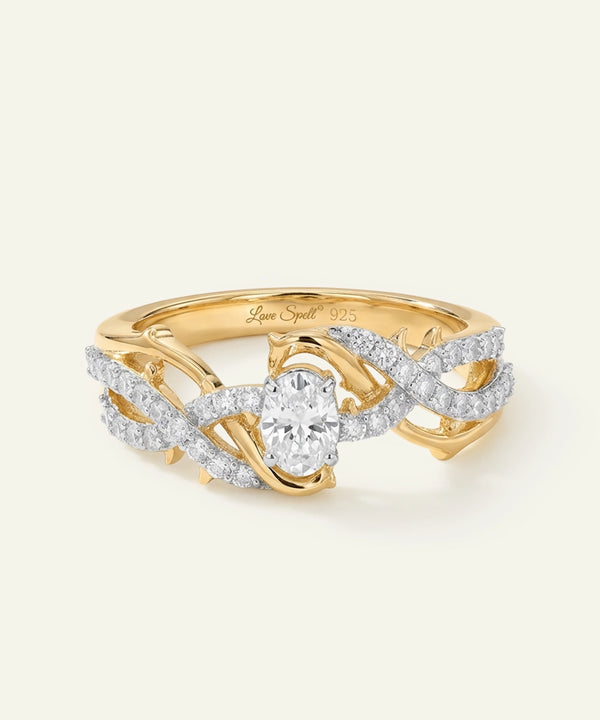 Gold ring with diamond accents on a light beige background