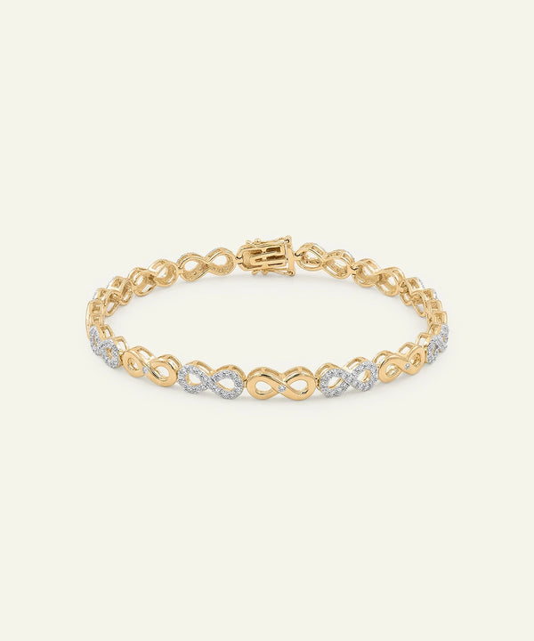 Gold bracelet with interlocking links on a light gray background