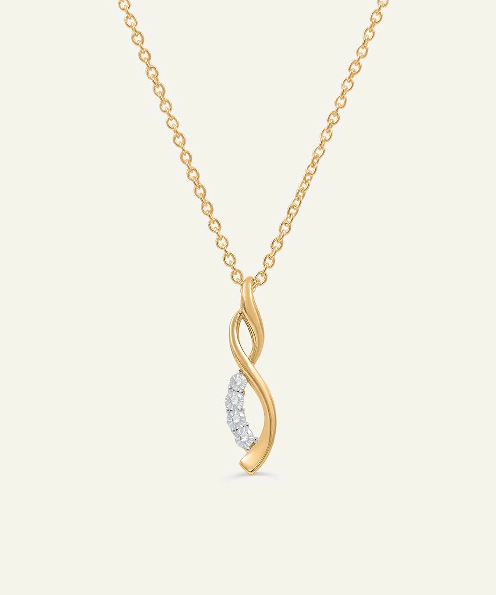 Gold necklace with a diamond pendant on a white background