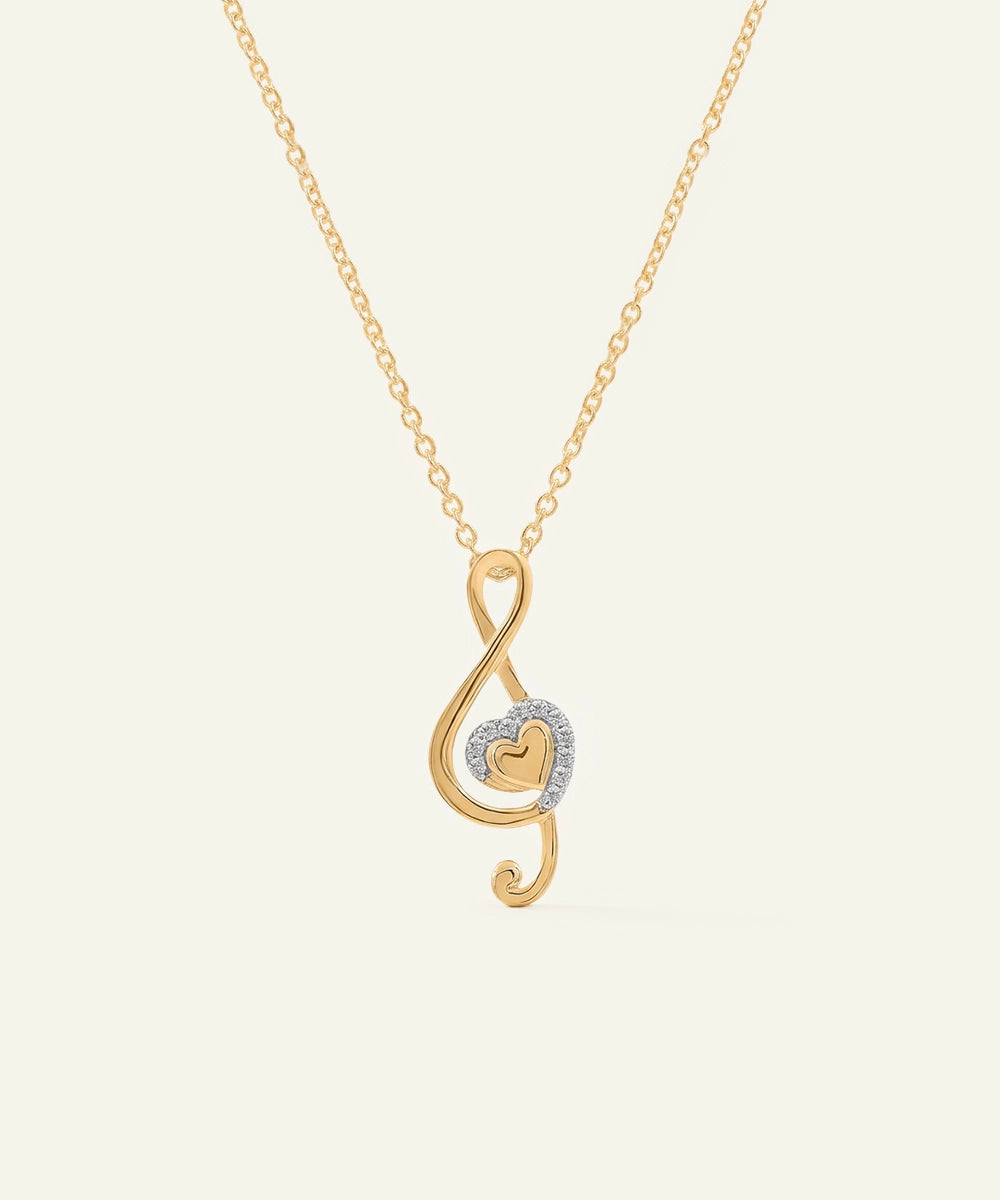 Gold necklace with a unique pendant on a light beige background