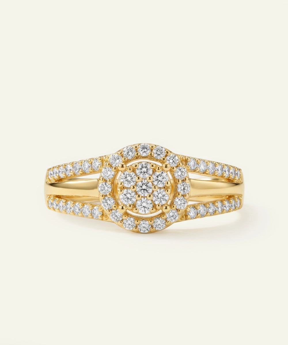 Gold ring with diamond accents on a light beige background